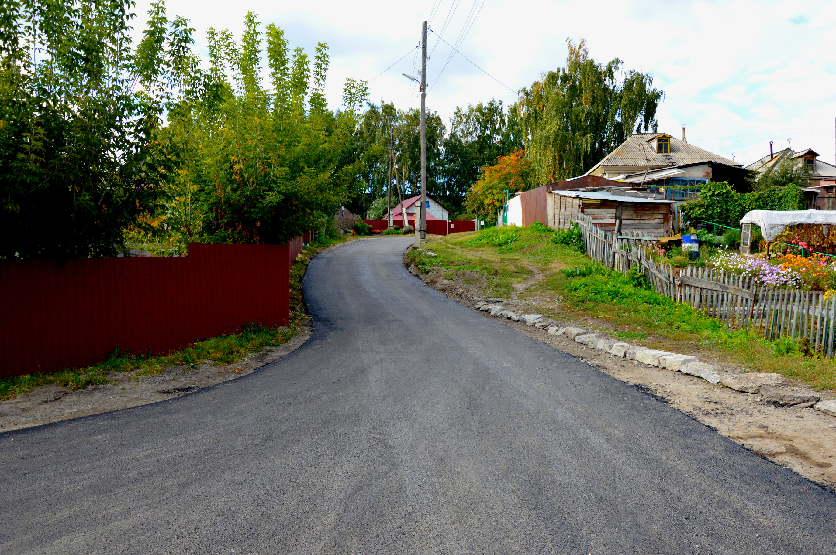 В Октябрьском районе продолжается ремонт дорог частного сектора